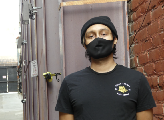 Photo of intern Marco Alvarado with mask on