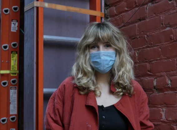 Photo of intern ella connor with mask on