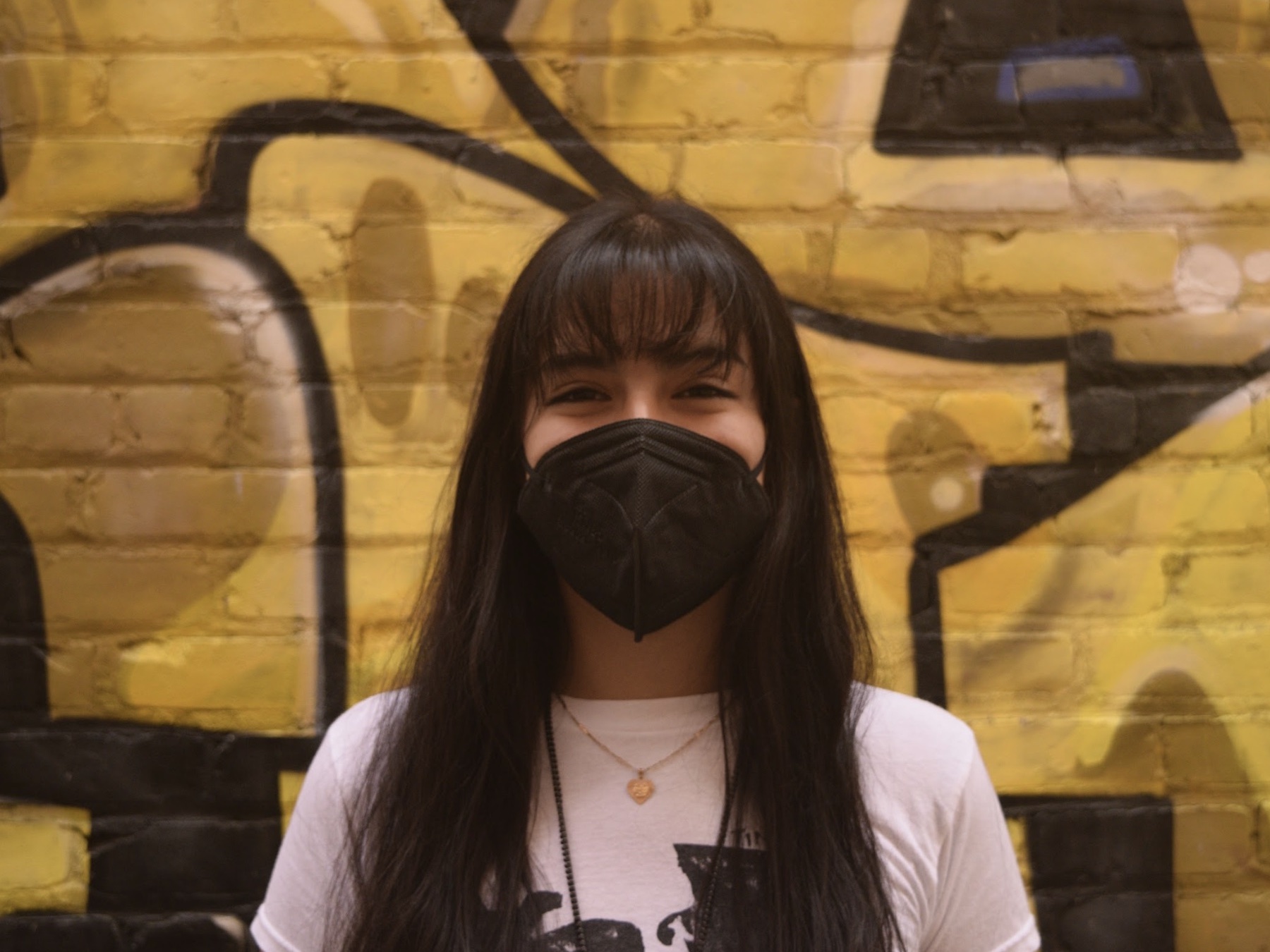 Photo of intern Maritza M. Tapia with mask on